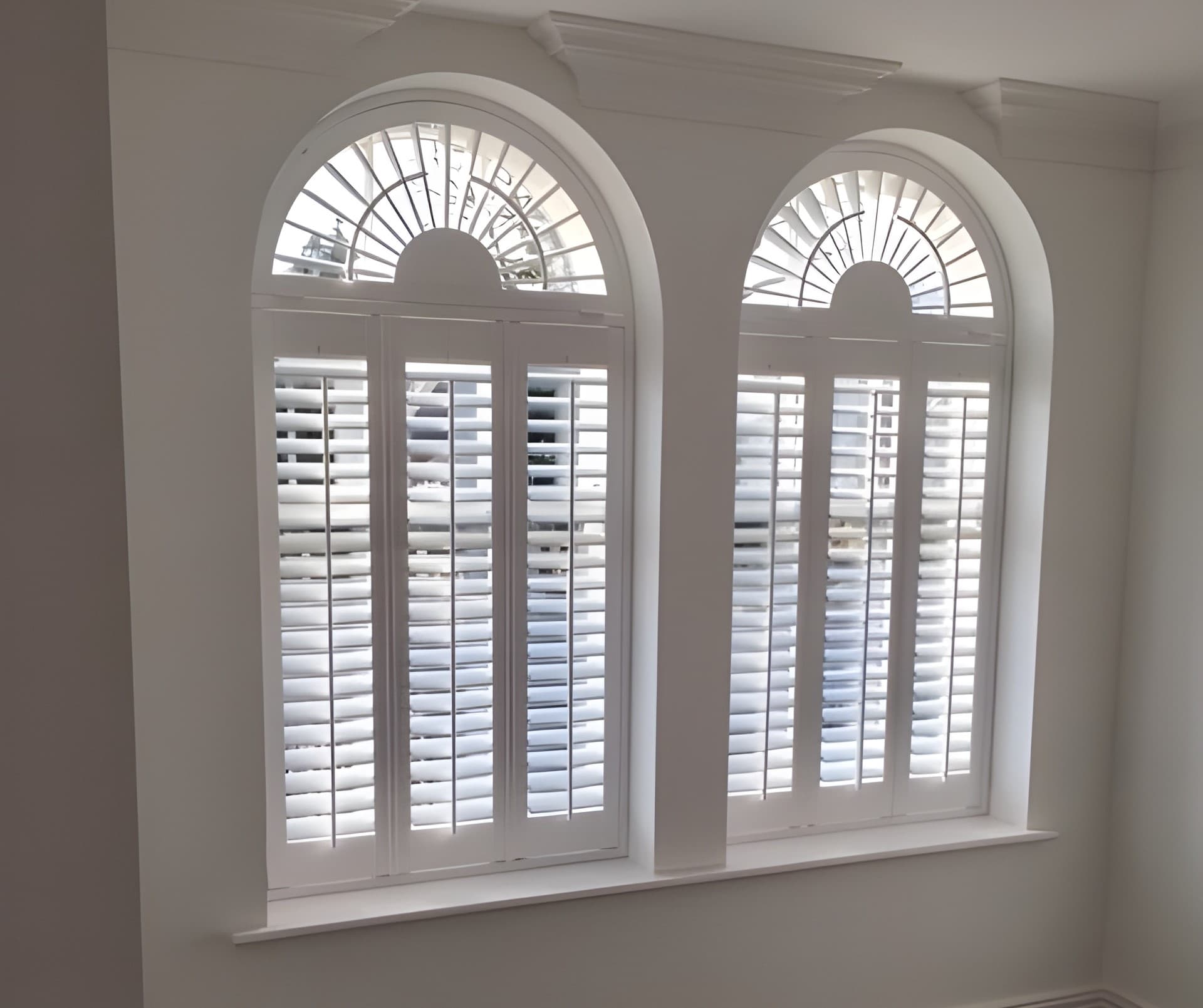Arched window shutters