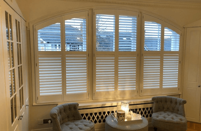 Plantation shutters for large, curved windows