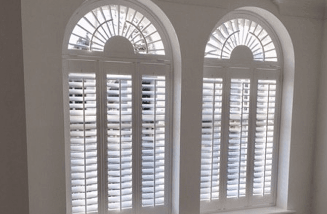Plantation shutters with a sunburst design