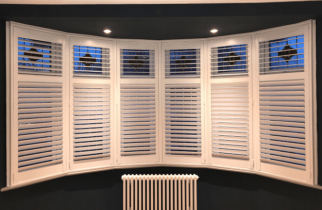 Plantation shutters for curved bay windows