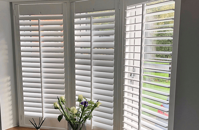 Plantation shutters for angled box bay windows