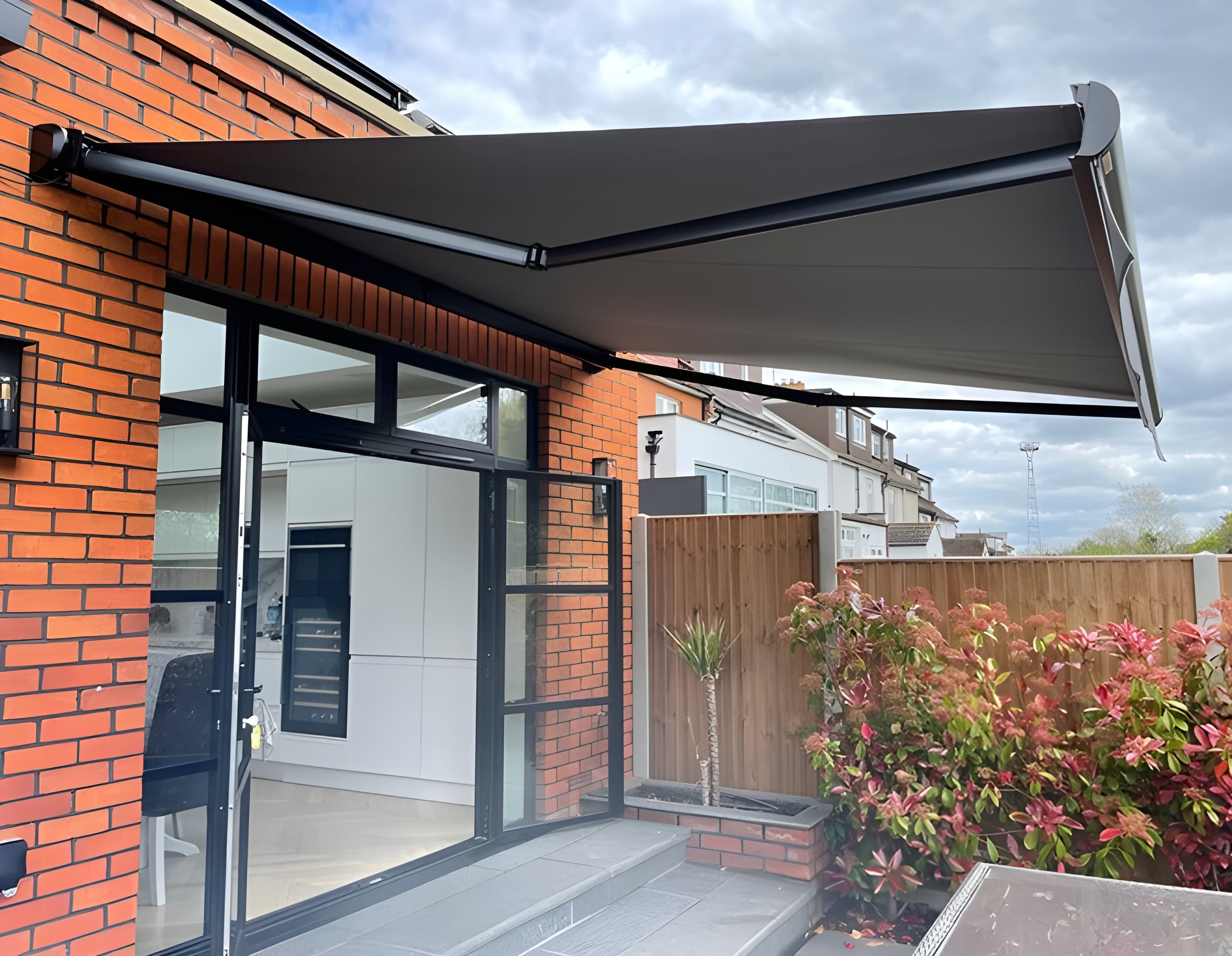 Motorised awnings for outdoor spaces