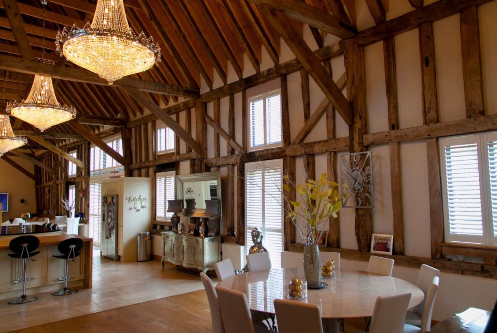 Chandeliers hanging in old barn style home