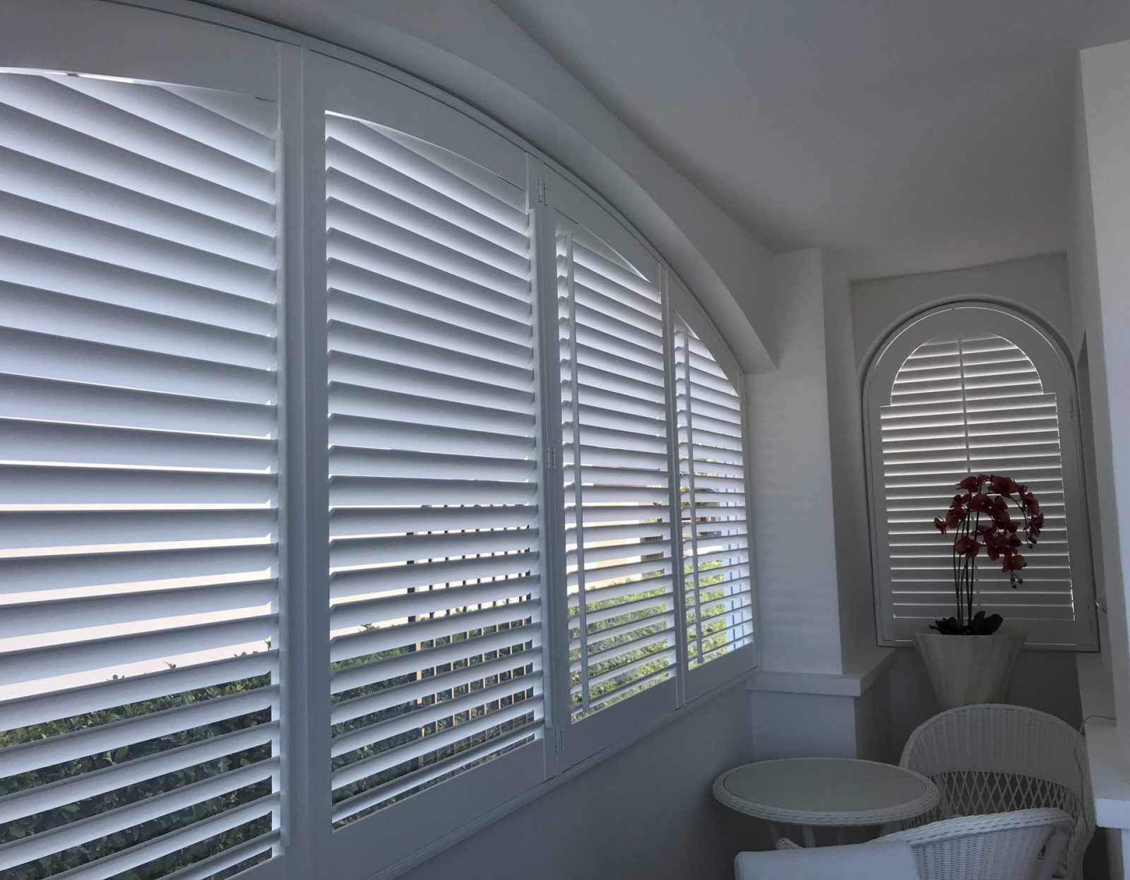 4 window arch wooden shutters in Chjelmsford home